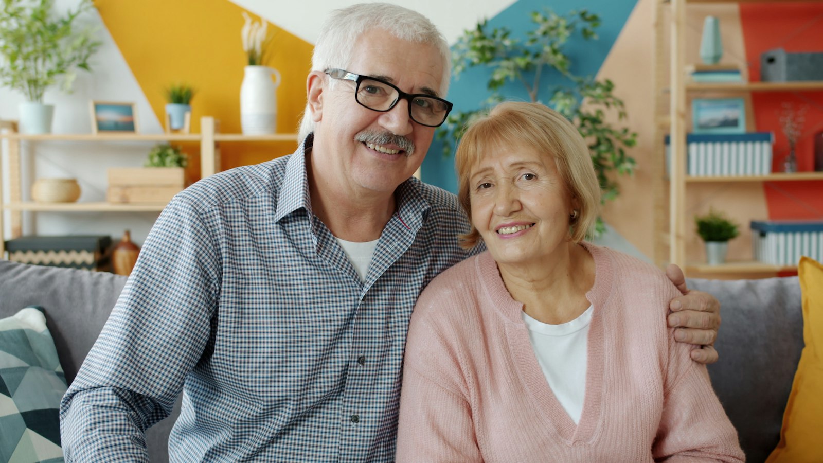 Couple smiling together on a couch