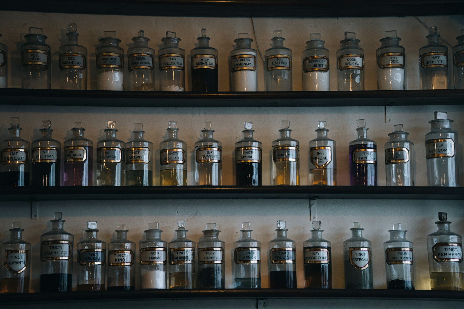 Rows of apothecary jars on shelves